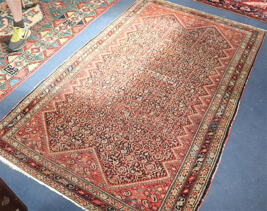 An Eastern rug, 201cm x 127cm